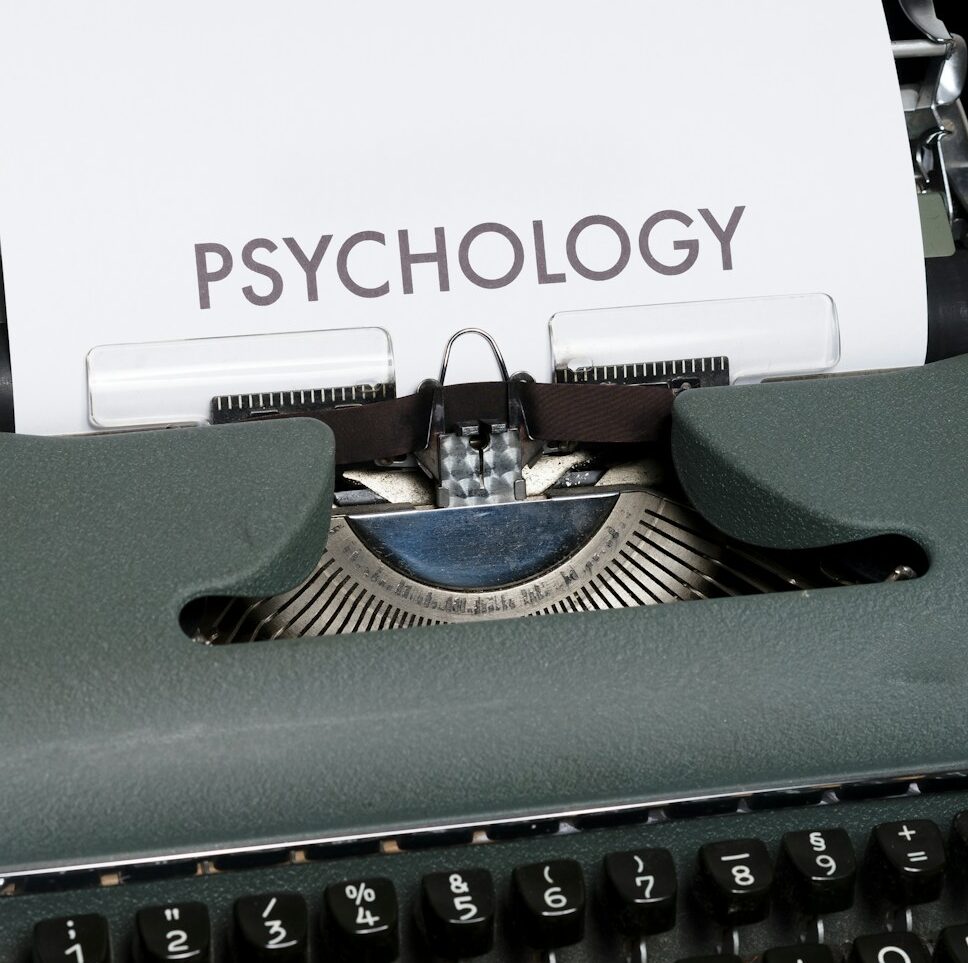 a close up of a typewriter with a paper on it